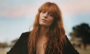 Woman with long wavy red hair.